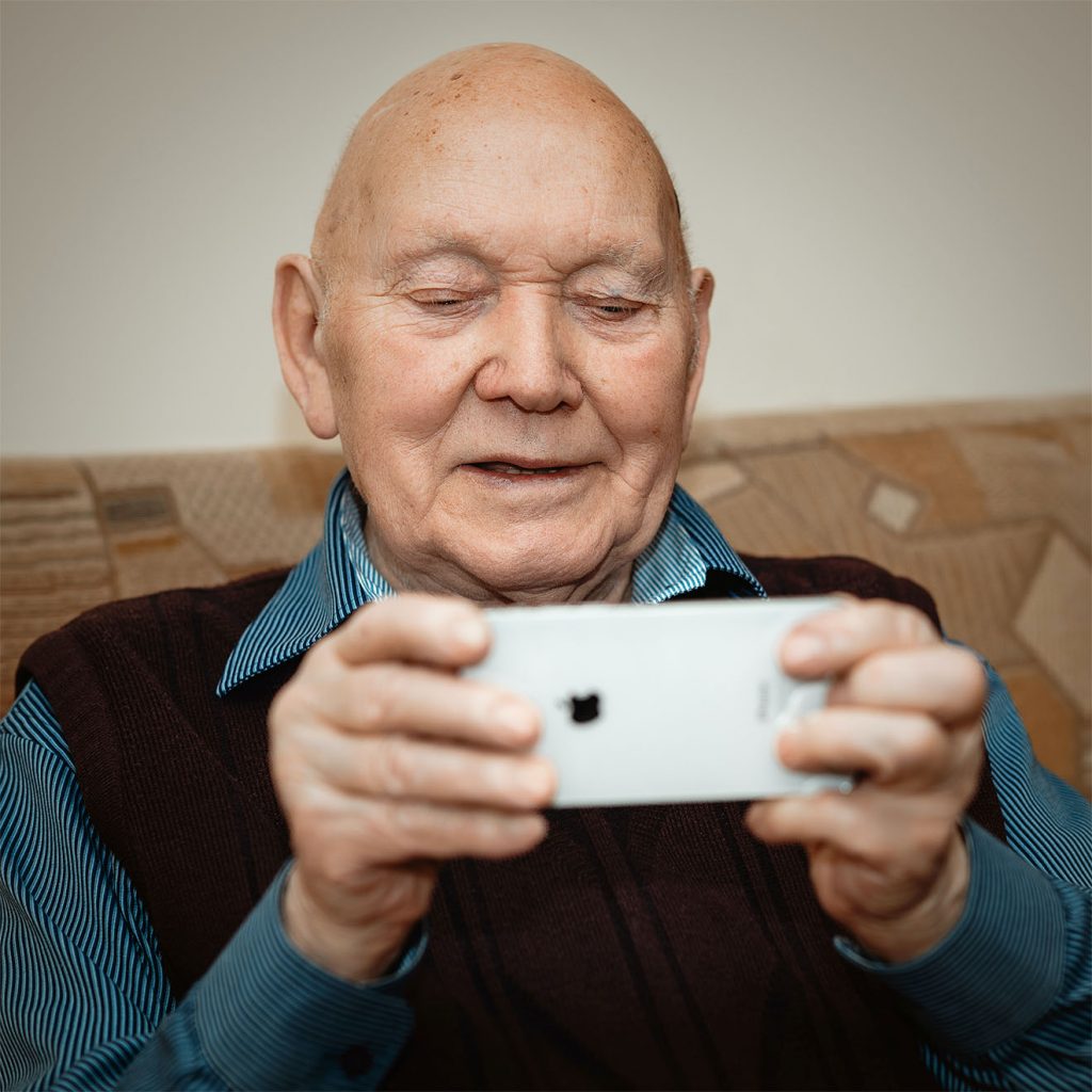 gentleman holding a phone