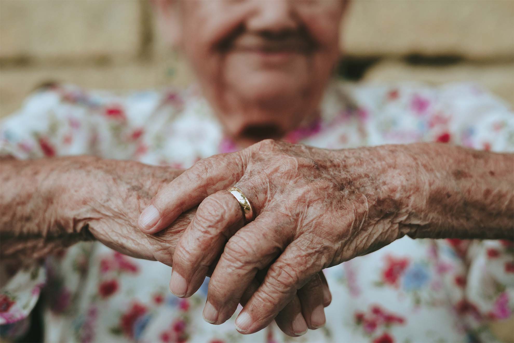 old lady holding her hands together