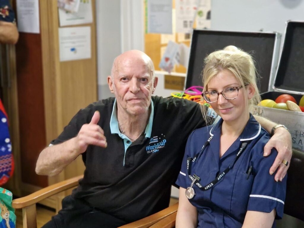 resident and nurse sitting together